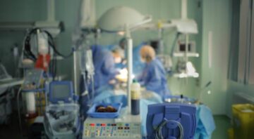 Urgent surgery in the ICU, unfocused background.